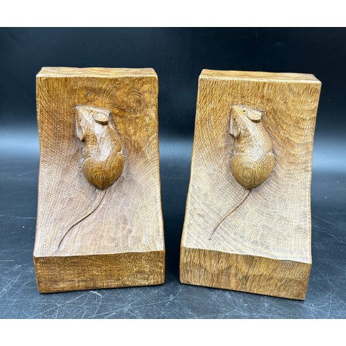 78 - Robert 'Mouseman' Thompson - a pair of oak adzed book ends. 15cm h.