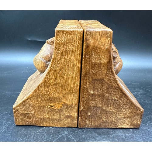 78 - Robert 'Mouseman' Thompson - a pair of oak adzed book ends. 15cm h.