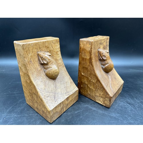 78 - Robert 'Mouseman' Thompson - a pair of oak adzed book ends. 15cm h.