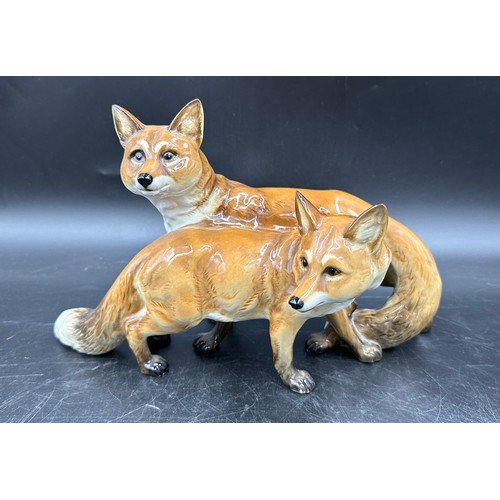 261 - A German Hutschenreuther porcelain figure group modelled as a pair of foxes, 17cm h x approx. 18cm w... 