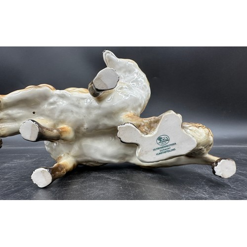 261 - A German Hutschenreuther porcelain figure group modelled as a pair of foxes, 17cm h x approx. 18cm w... 