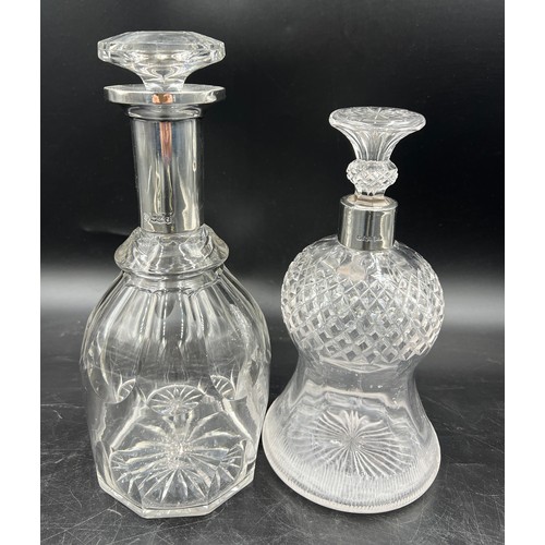 276 - Two silver necked glass decanters to include Sheffield 1901, maker Walker and Hall and Sheffield 192... 