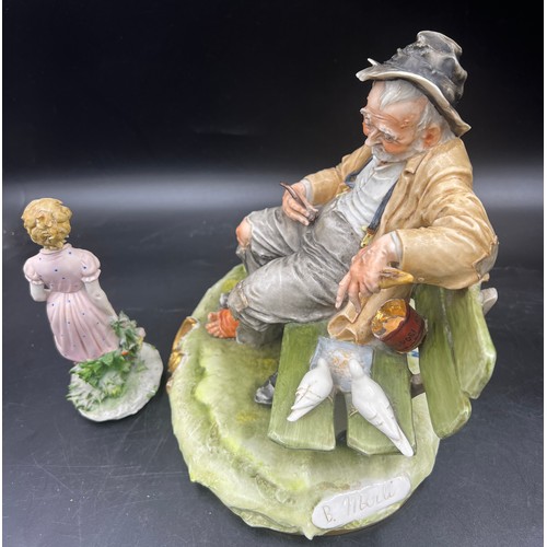 Capodimonte man on bench feeding store birds