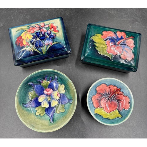 254 - A collection of four pieces of Moorcroft pottery two oblong boxes with covers approx 9cm x 11.5cm x ... 