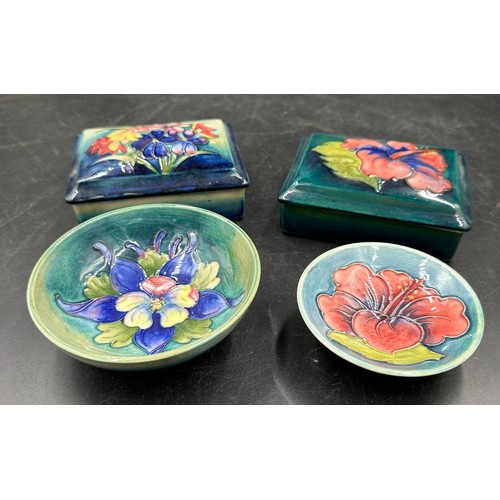 254 - A collection of four pieces of Moorcroft pottery two oblong boxes with covers approx 9cm x 11.5cm x ... 