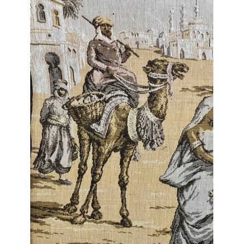 719 - A large early 19thC machine made tapestry-style picture of a Middle Eastern market/street scene in a... 