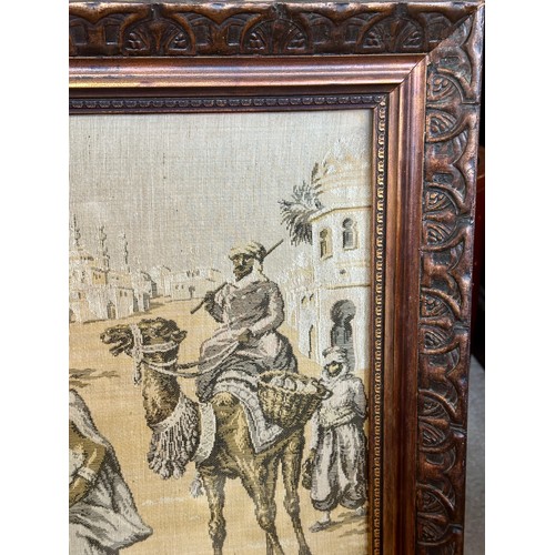 719 - A large early 19thC machine made tapestry-style picture of a Middle Eastern market/street scene in a... 