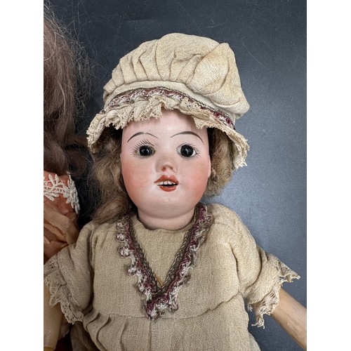 1130 - Three bisque headed dolls to include one with the head impressed 'P.R / S.F.B.J. / 60 / PARIS /8/0' ... 