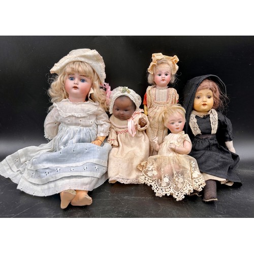 1131 - Five various dolls to include four bisque dolls, one  with crossed swords to back of head, blonde ha... 