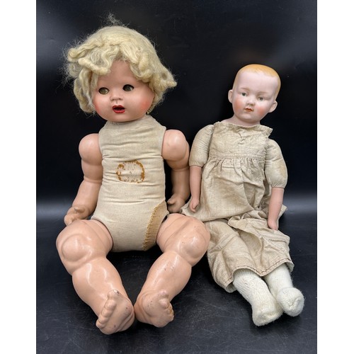 1121 - A Diamond Pottery Company bisque headed boy doll marked D.P.C 39-12 approx. 60cm together with a Ind... 