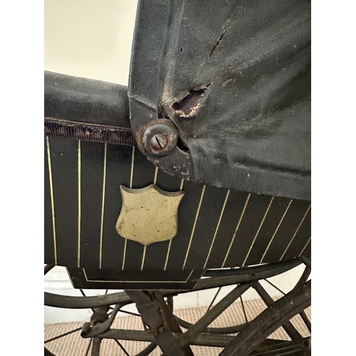 1127 - A metal Edwardian dolls pram. Approx. 64cm h to top of handles and 87cm long. A restoration project.