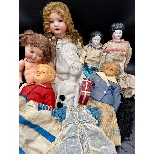 1129 - A Victorian doll's dress and cape together with a collection of mainly 19thC dolls to include a Heub... 