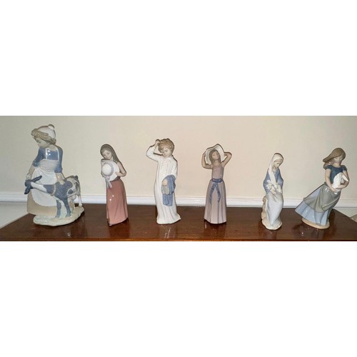 234 - Three Nao by Lladro figurines to include girl with a goat approx. 30cm h, girl with a rabbit approx.... 