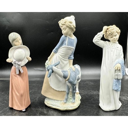 234 - Three Nao by Lladro figurines to include girl with a goat approx. 30cm h, girl with a rabbit approx.... 