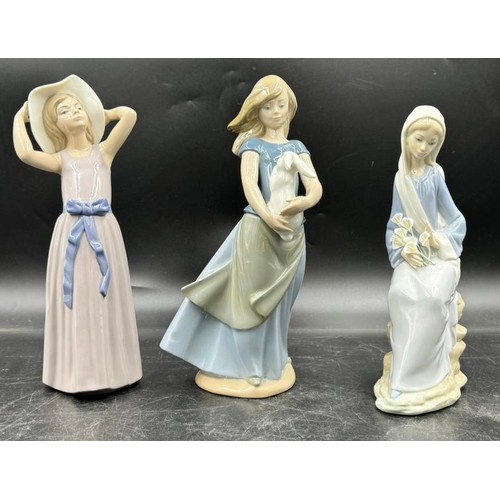 234 - Three Nao by Lladro figurines to include girl with a goat approx. 30cm h, girl with a rabbit approx.... 