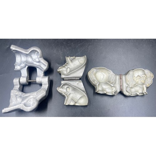 1264 - Three marzipan moulds of a a pig, an elephant and an Anton Reiche dog. Approx. 8 x 7cm.