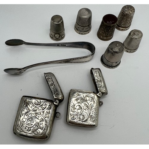 939 - Silver to include 5 hallmarked silver thimbles, 1 with glass top, 1 white metal thimble, 2 vesta cas... 