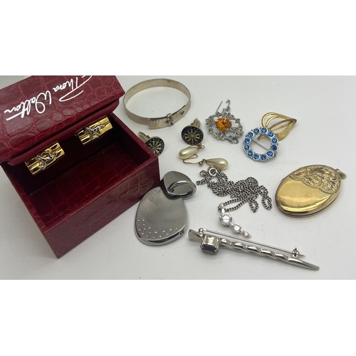 425 - Costume jewellery to include silver bangle, silver locket, pendant, cufflinks etc.