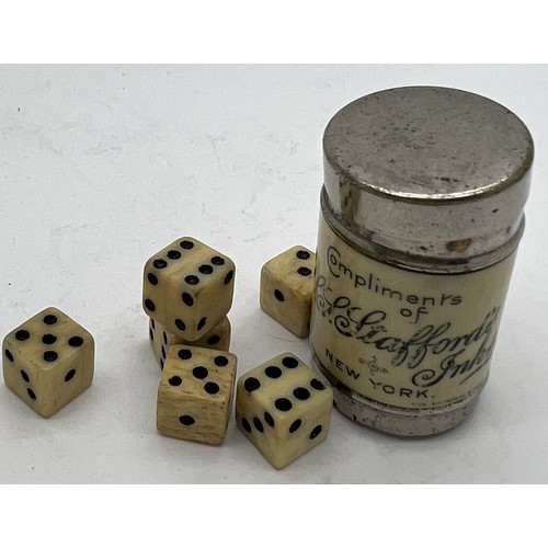 1267 - An SS Stafford’s Inks of New York advertising tin containing six dice. 3.5cm h.