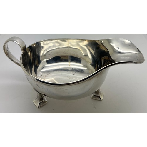 934 - A silver sauce boat Birmingham 1939, maker Albert Edward Jones. Weight 208gm. 18cm l.