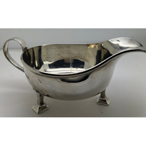 934 - A silver sauce boat Birmingham 1939, maker Albert Edward Jones. Weight 208gm. 18cm l.