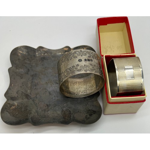 927 - Silver dish, Birmingham 1968 and two silver napkin rings, London 1903 and 1970. Total weight 128gm.