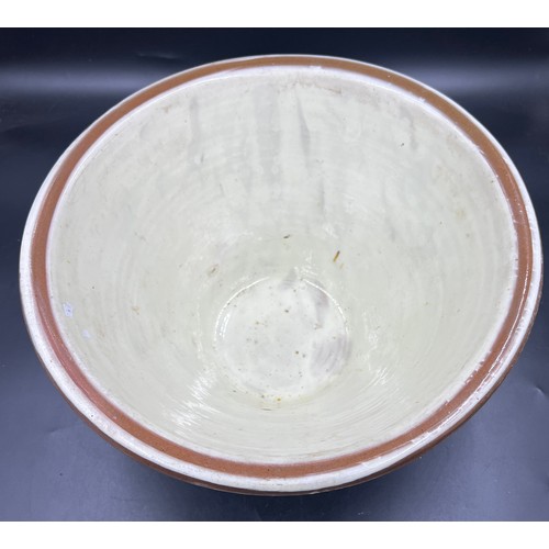 230 - A Victorian cream glazed bread mixing bowl. 42cm d.