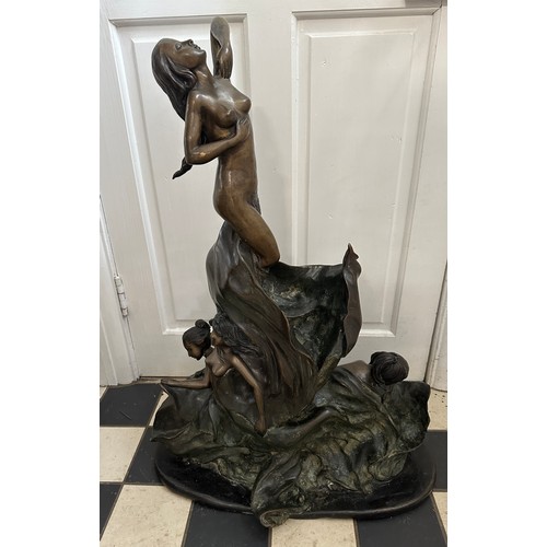 1276 - A large heavy, metal sculpture of mermaids amidst the waves. Height approx. 80cm, base width 60cm.