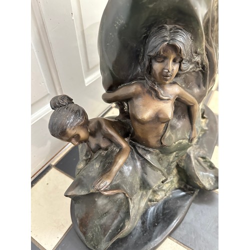 1276 - A large heavy, metal sculpture of mermaids amidst the waves. Height approx. 80cm, base width 60cm.