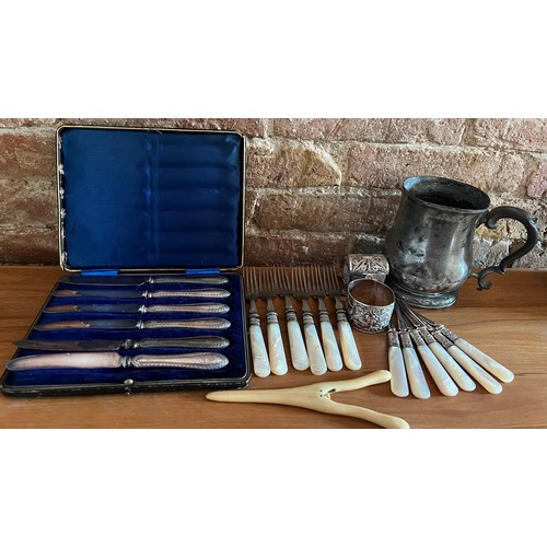 1283 - A miscellany to include 6 mother of pearl handled walnut picks, boxed silver handled dessert knives,... 