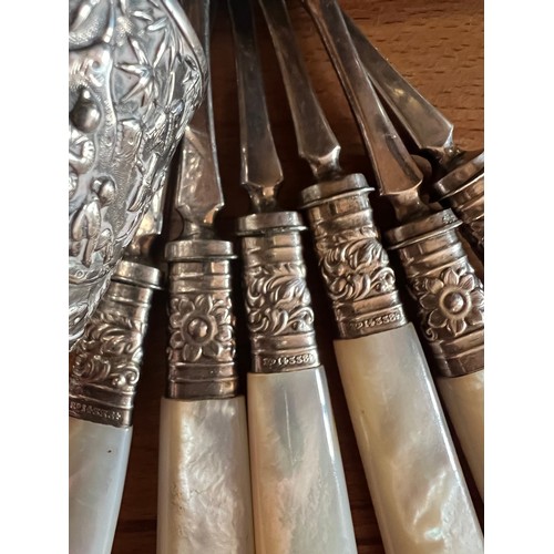 1283 - A miscellany to include 6 mother of pearl handled walnut picks, boxed silver handled dessert knives,... 