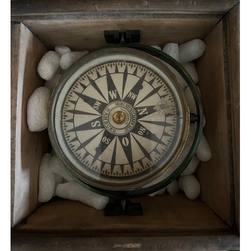 1284 - A gamble mounted ships compass in wood outer case, lacking lid. Case 18cm x 18cm. Maker Georg Hechel... 