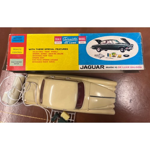 1115 - Telsalda De Luxe Jaguar Mark 10 Saloon, cream plastic body with friction motor, roof rack and five p... 