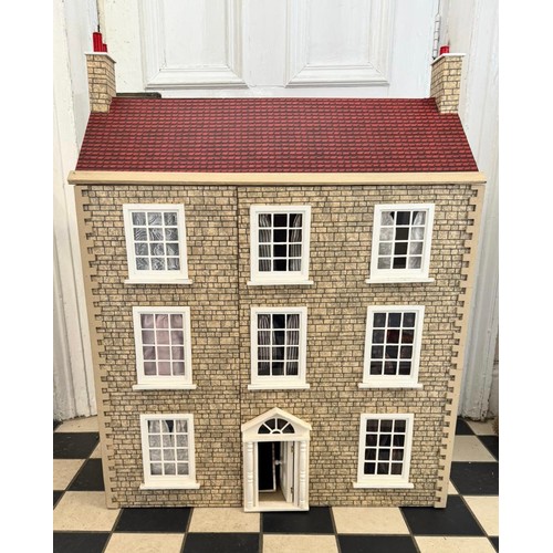 1154 - A large 20thC doll's house opening to reveal decorated rooms over 3 stories. 74cm x 96cm h to includ... 