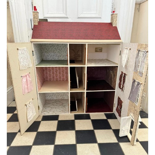 1154 - A large 20thC doll's house opening to reveal decorated rooms over 3 stories. 74cm x 96cm h to includ... 