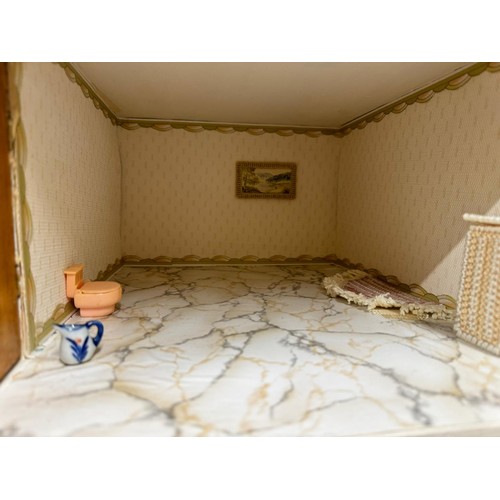 1154 - A large 20thC doll's house opening to reveal decorated rooms over 3 stories. 74cm x 96cm h to includ... 