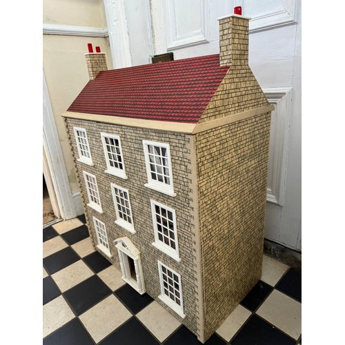 1154 - A large 20thC doll's house opening to reveal decorated rooms over 3 stories. 74cm x 96cm h to includ... 