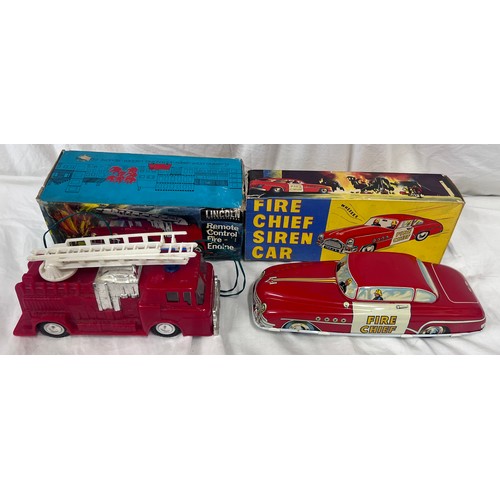 1156 - A tin plate Fire Chief Siren Car 9/147 by Welsotoys and a Lincoln International Remote Control Fire ... 