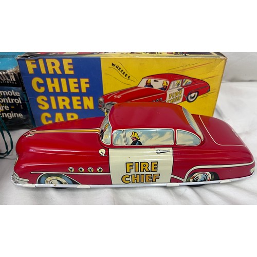 1156 - A tin plate Fire Chief Siren Car 9/147 by Welsotoys and a Lincoln International Remote Control Fire ... 