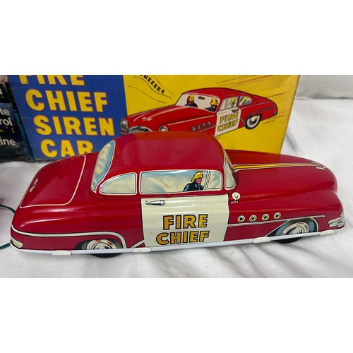 1156 - A tin plate Fire Chief Siren Car 9/147 by Welsotoys and a Lincoln International Remote Control Fire ... 