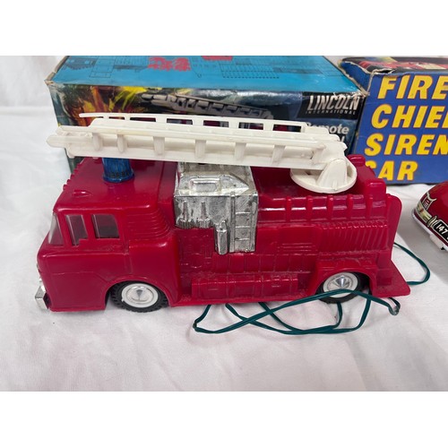 1156 - A tin plate Fire Chief Siren Car 9/147 by Welsotoys and a Lincoln International Remote Control Fire ... 