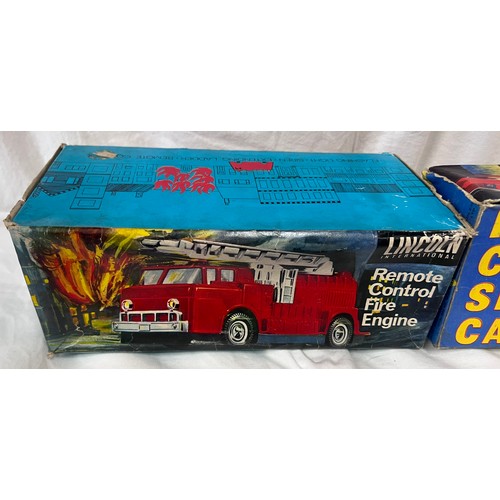 1156 - A tin plate Fire Chief Siren Car 9/147 by Welsotoys and a Lincoln International Remote Control Fire ... 