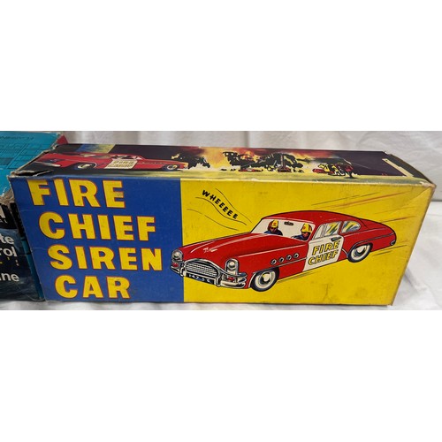 1156 - A tin plate Fire Chief Siren Car 9/147 by Welsotoys and a Lincoln International Remote Control Fire ... 