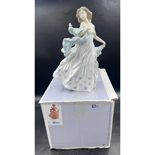 216 - Lladro boxed 6193 ' Summer Serenade ' figure, depicting a young woman with dress and bird, 30 cm h.