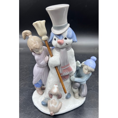 220 - A boxed Lladro porcelain figure group 5713 The Snow Man, 20.5cm h.