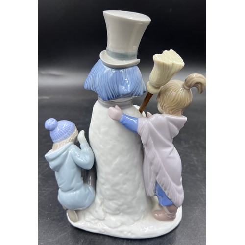 220 - A boxed Lladro porcelain figure group 5713 The Snow Man, 20.5cm h.