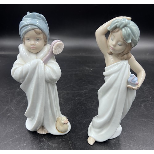 221 - Two boxed Lladro figurines to include 6800 Bundled Bather and 6799 Just Like New.