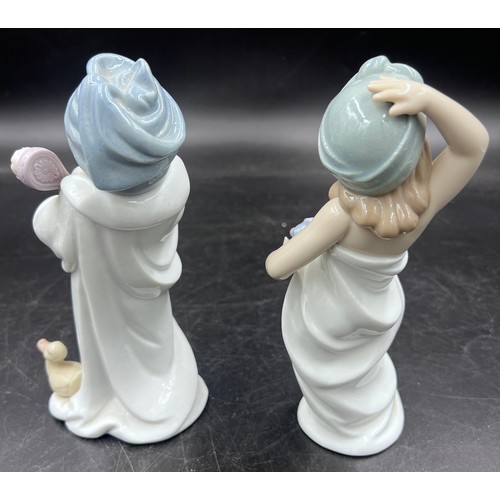 221 - Two boxed Lladro figurines to include 6800 Bundled Bather and 6799 Just Like New.