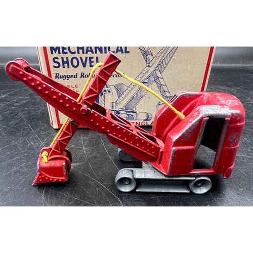 1167 - A boxed Made in England diecast model of a mechanical shovel finished in red. Original box.