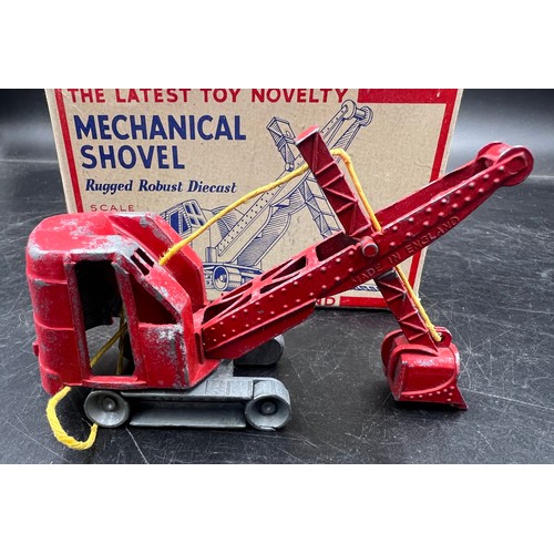 1167 - A boxed Made in England diecast model of a mechanical shovel finished in red. Original box.